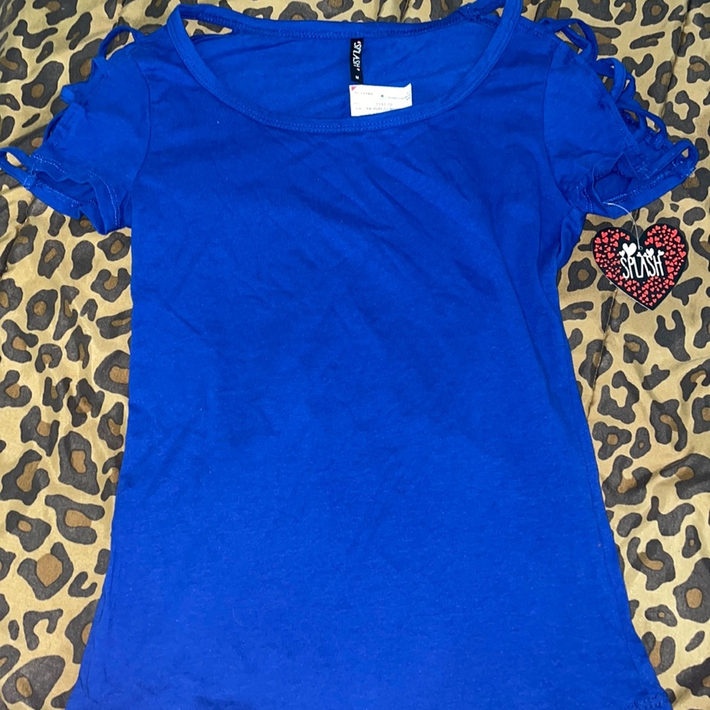 blue top with cross cross open sleeves